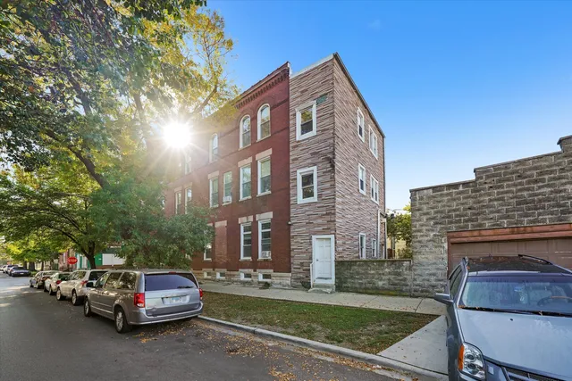 a car parked in front of brick building