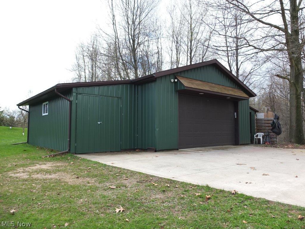 176 Manning Road Mogadore, OH 44260 - Photo 22 of 25 24x32 garage with two 10x24 enclosed extensions.