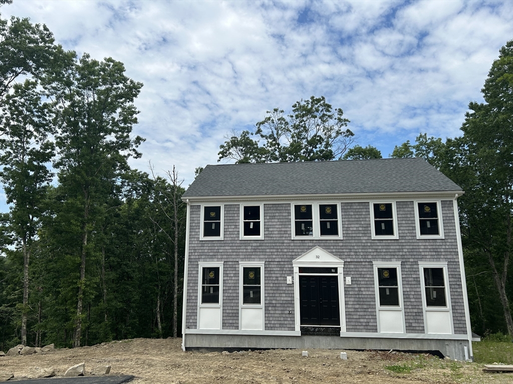 32 Brookside Avenue Webster, MA 01570 - Photo 12 of 12 a house with a tree in front of it
