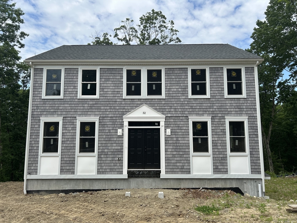 32 Brookside Avenue Webster, MA 01570 - Photo 3 of 12 a front view of a house with a yard
