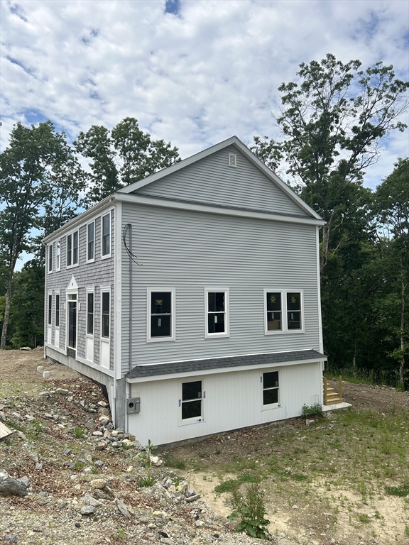 32 Brookside Avenue Webster, MA 01570 - Photo 5 of 12 a house that has tree in front of it