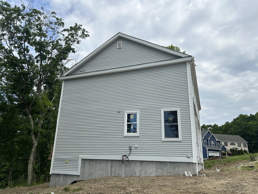 32 Brookside Avenue Webster, MA 01570 - Photo 9 of 12 a front view of a house with a garage