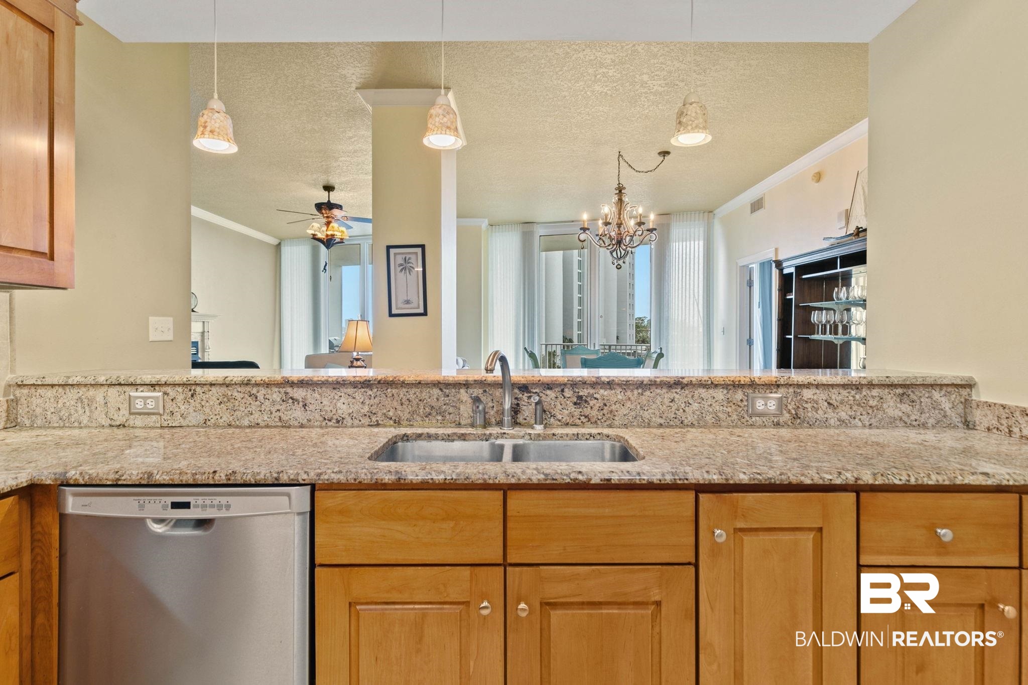 28250 Canal Road, Unit 208 Orange Beach, AL 36561 - Photo 18 of 53 Kitchen with crown molding, ceiling fan, stainless steel dishwasher, a textured ceiling, and light stone countertops