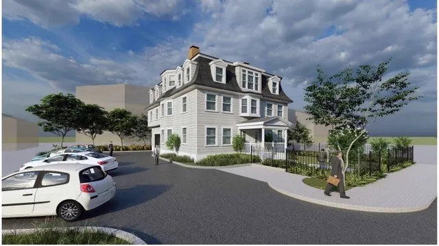 a front view of a house with a garden