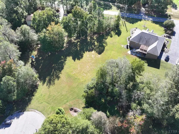 a aerial view of a house with a yard