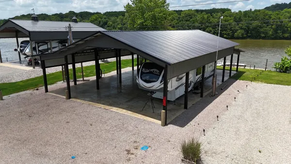 a view of a wooden deck front of house