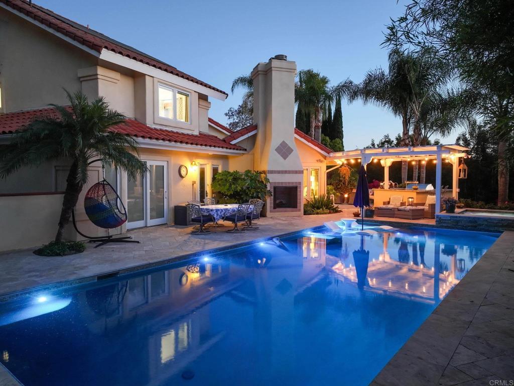 13348 Old Winery Road Poway, CA 92064 - Photo 5 of 68 a view of a house with swimming pool