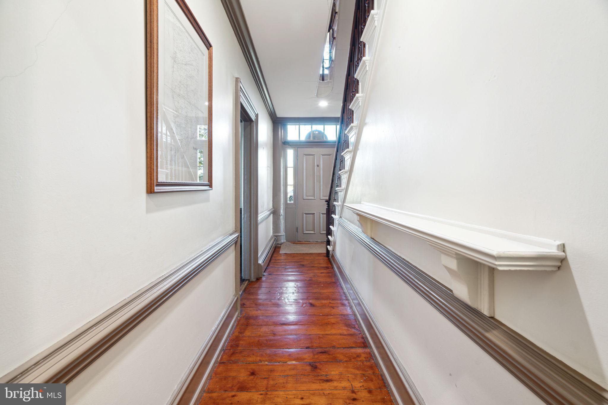 162 Sheehan Road Avondale, PA 19311 - Photo 12 of 83 a view of a hallway with wooden floor and staircase