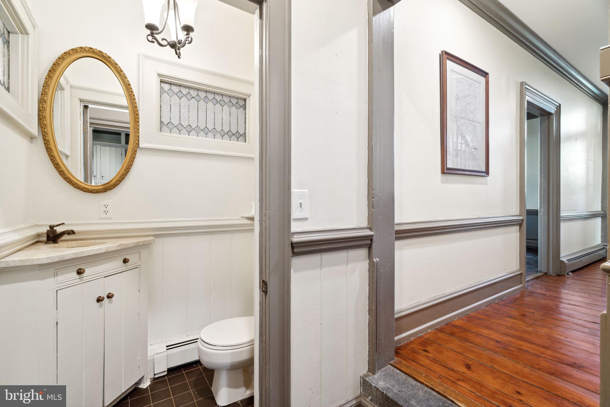 162 Sheehan Road Avondale, PA 19311 - Photo 13 of 83 a bathroom with a toilet a sink and a mirror