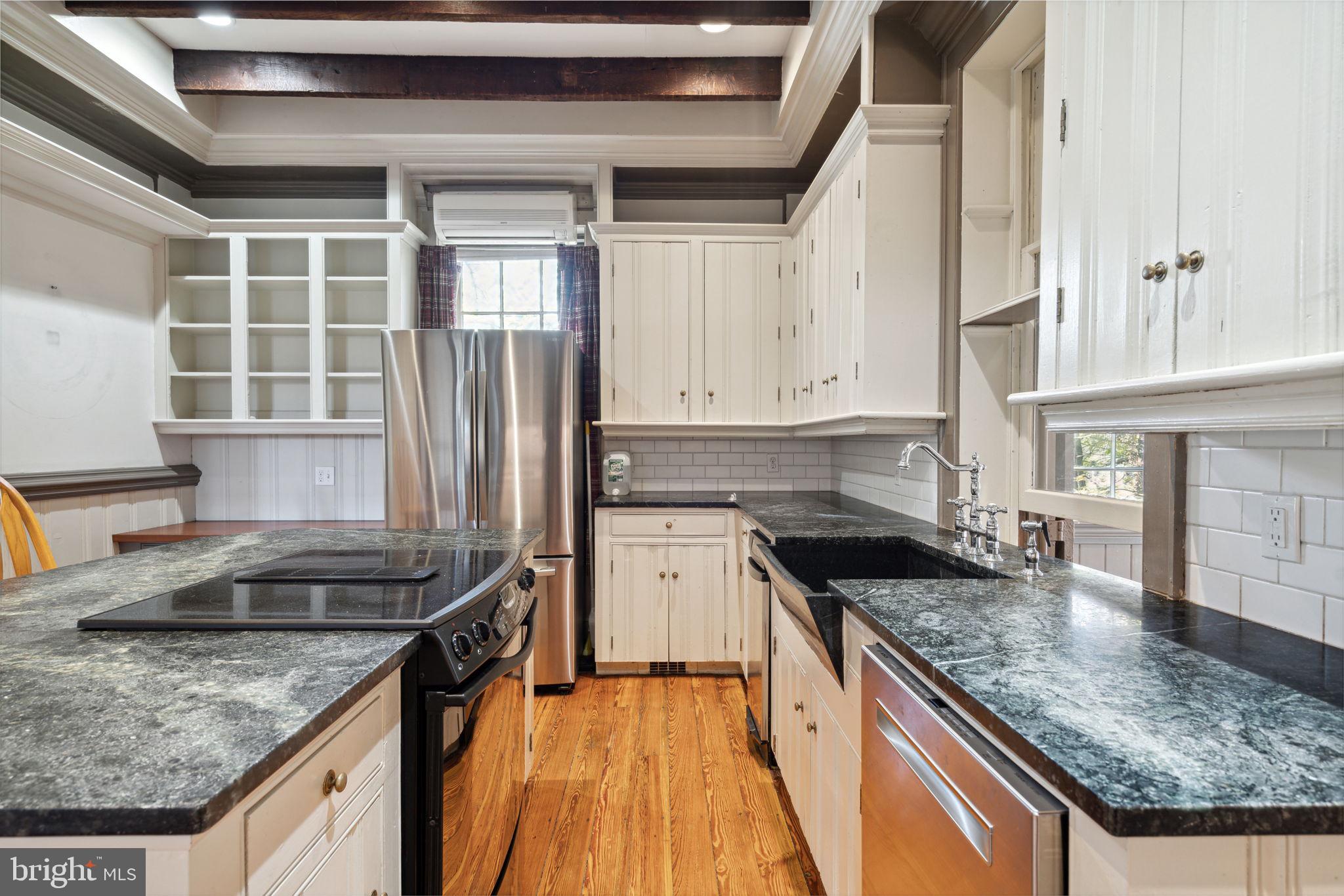 162 Sheehan Road Avondale, PA 19311 - Photo 18 of 83 a kitchen with granite countertop a sink a counter top space and stainless steel appliances