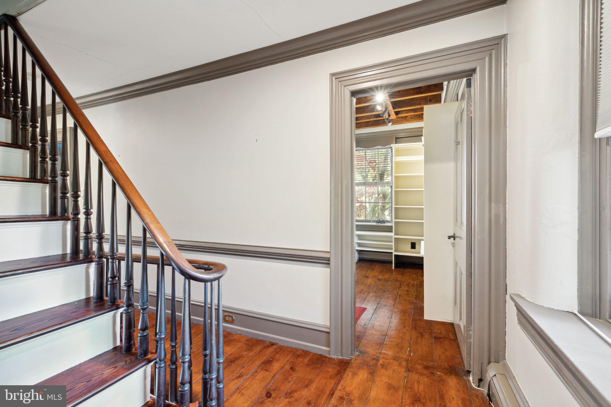 162 Sheehan Road Avondale, PA 19311 - Photo 34 of 83 a view of a hallway with wooden floor and stairs