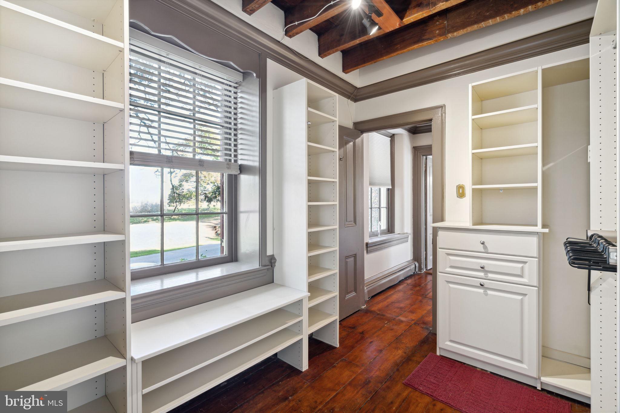 162 Sheehan Road Avondale, PA 19311 - Photo 36 of 83 a view of walk in closet with wooden floor and floors