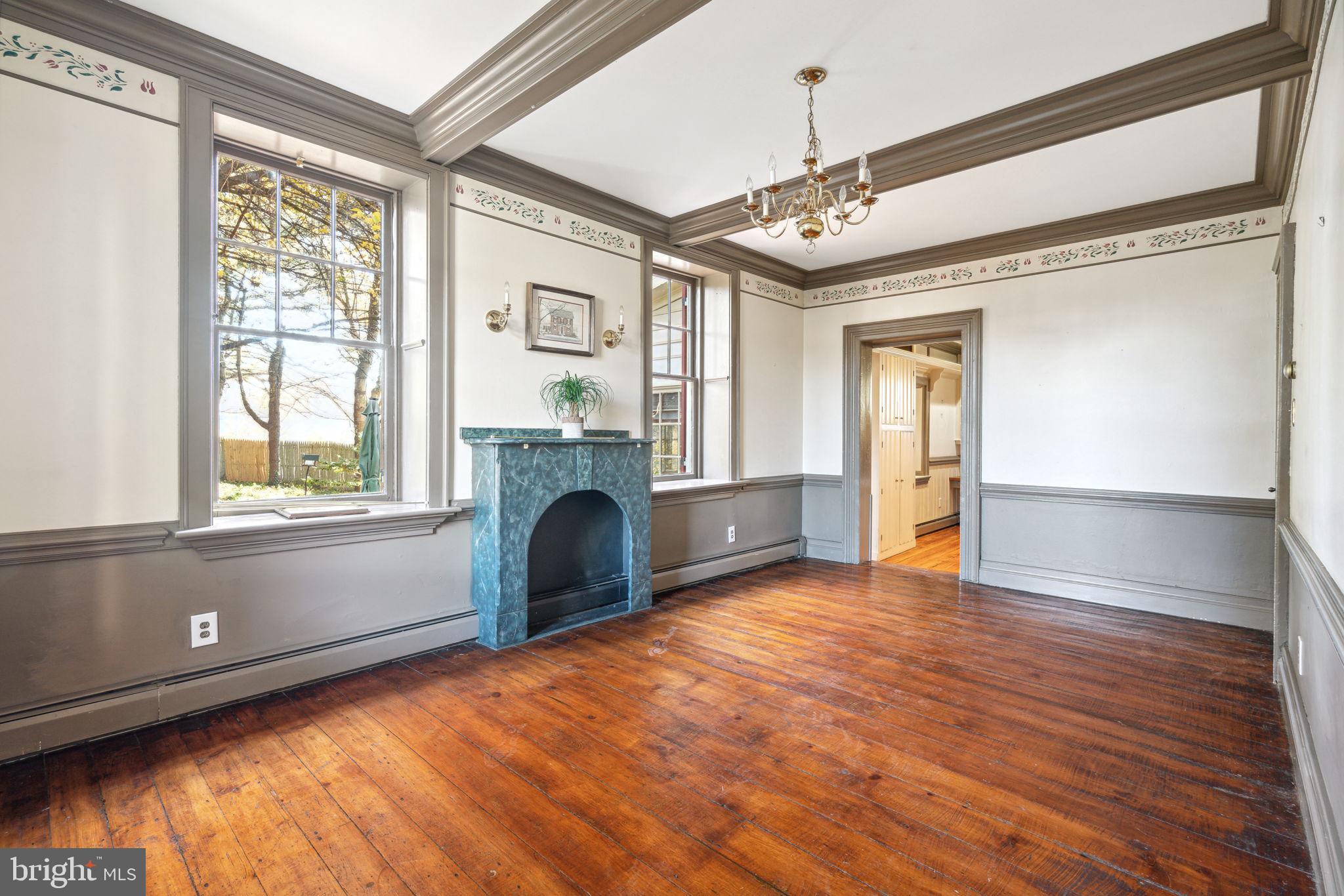 162 Sheehan Road Avondale, PA 19311 - Photo 7 of 83 a view of an empty room with a window and wooden floor