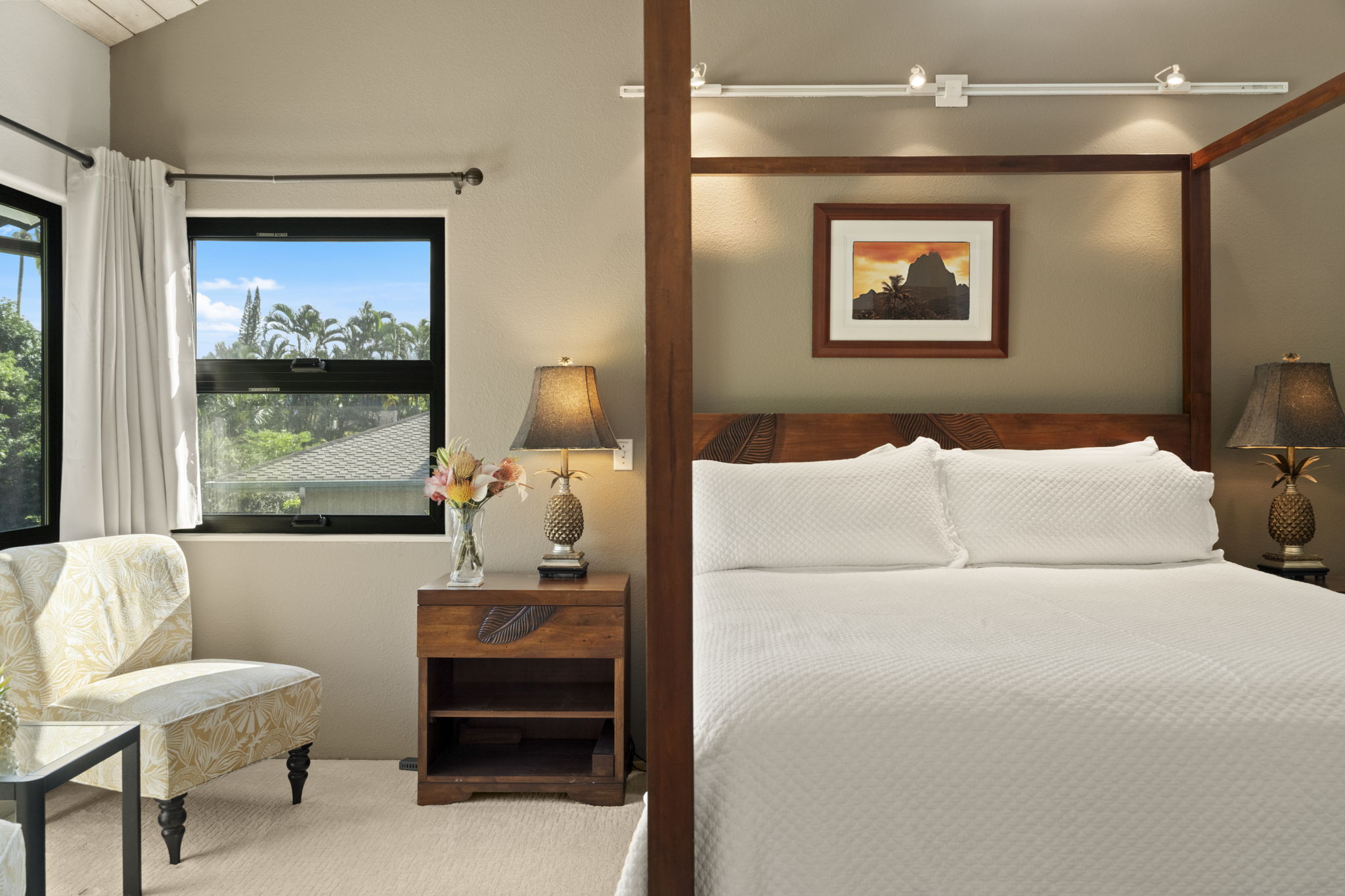 3835 Punahele Road Princeville, HI 96722 - Photo 11 of 30 a bedroom with a bed and a painting on the wall