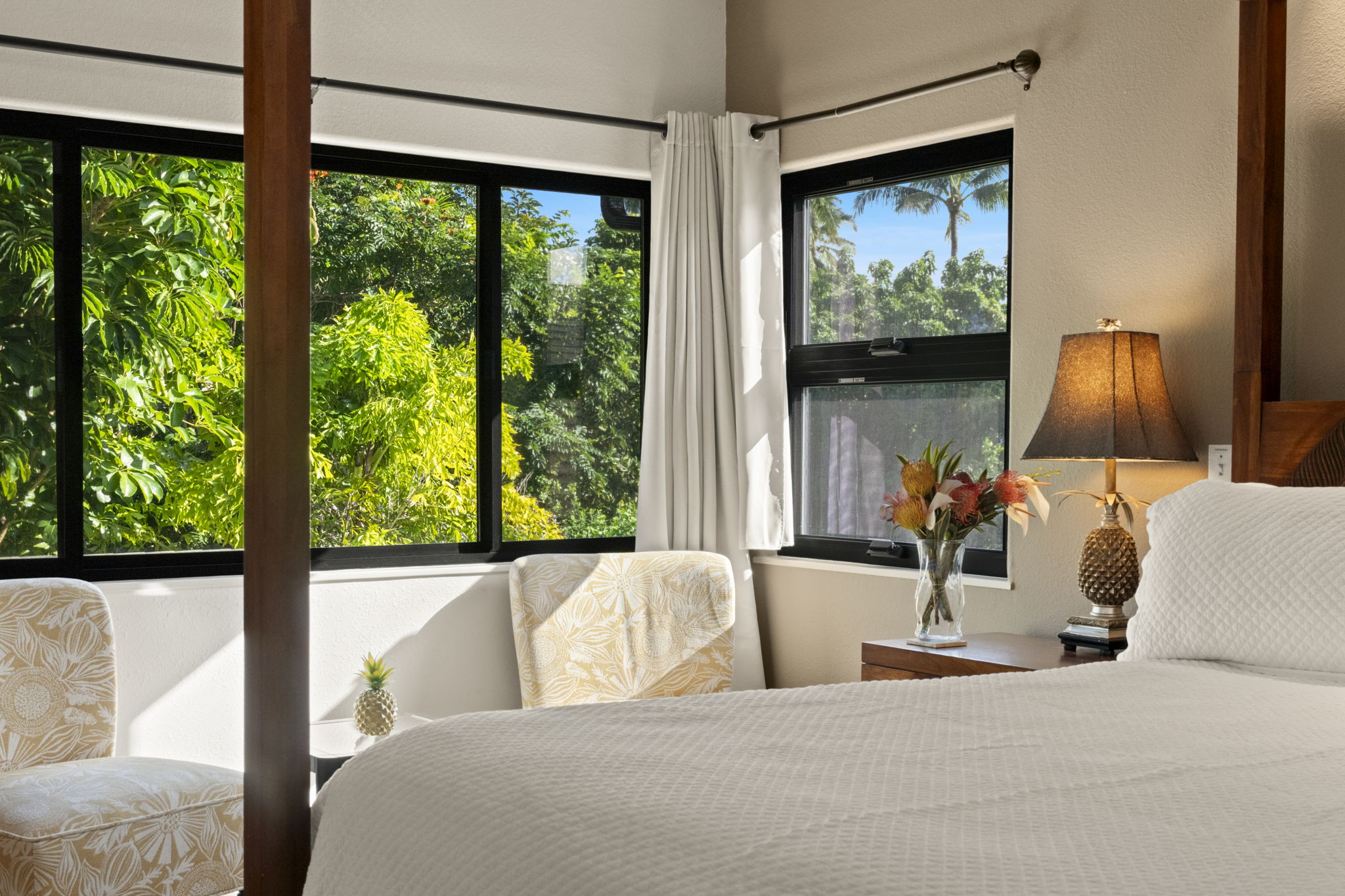 3835 Punahele Road Princeville, HI 96722 - Photo 12 of 30 a bedroom with a bed and a large window