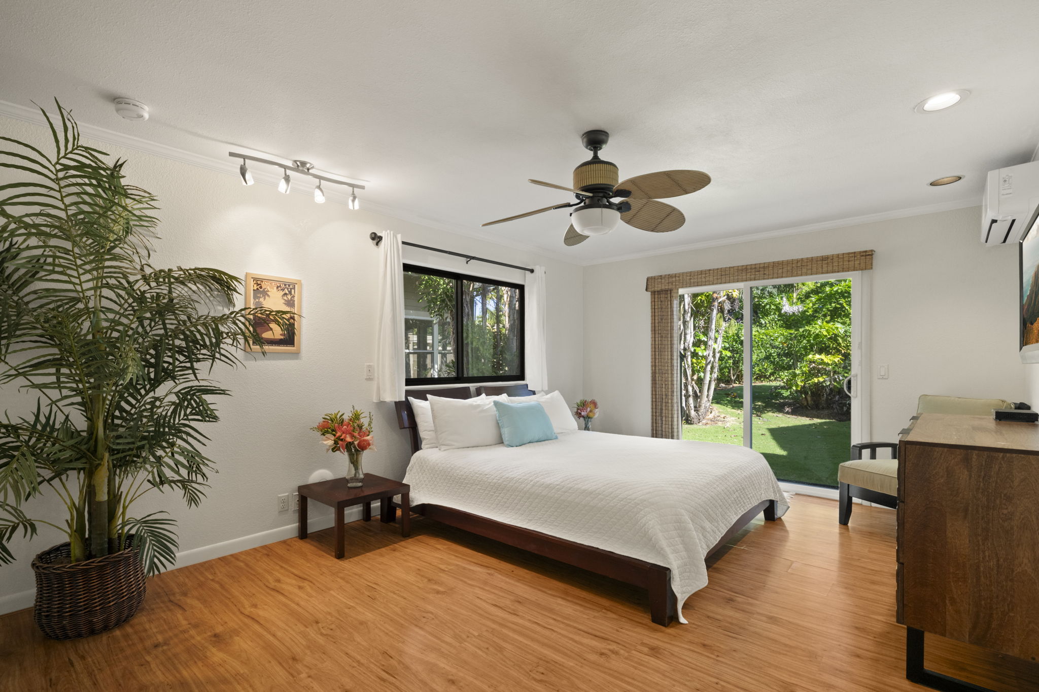3835 Punahele Road Princeville, HI 96722 - Photo 15 of 30 a bedroom with a bed and a chandelier