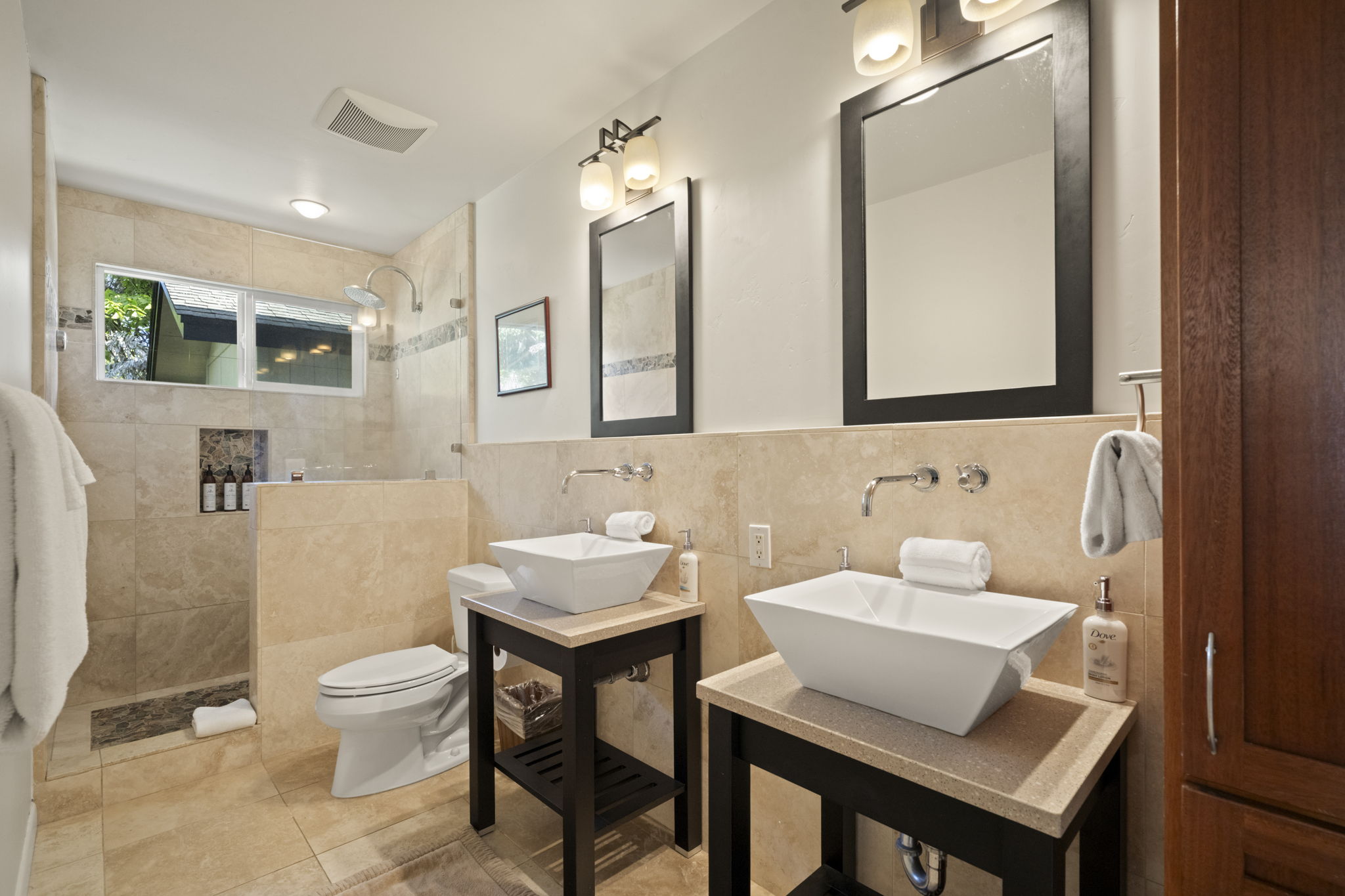 3835 Punahele Road Princeville, HI 96722 - Photo 17 of 30 a bathroom with a toilet a sink and a mirror