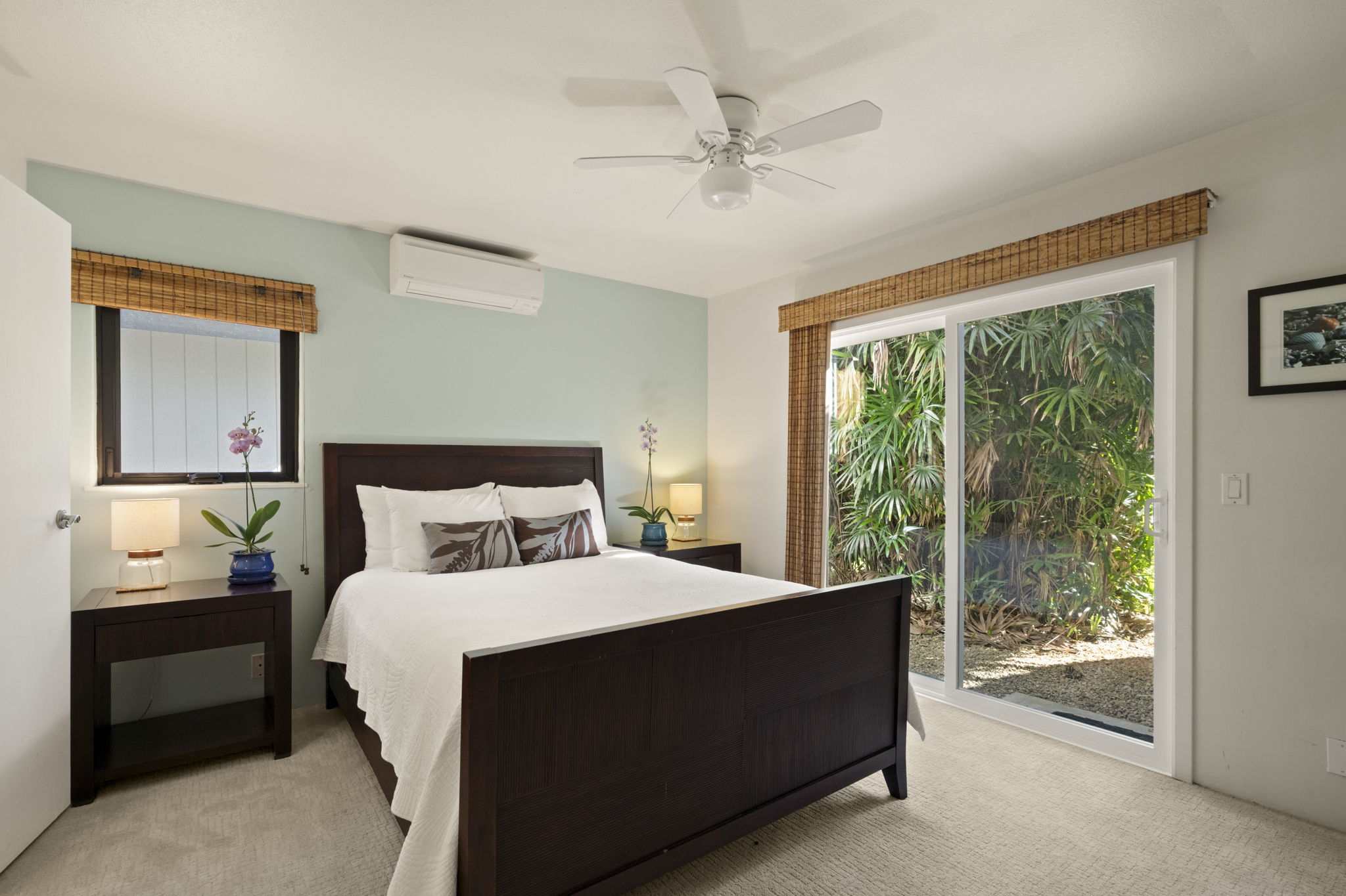 3835 Punahele Road Princeville, HI 96722 - Photo 18 of 30 a bedroom with a bed and large window