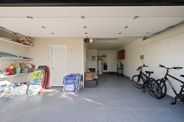 a yellow house with garden in front of it