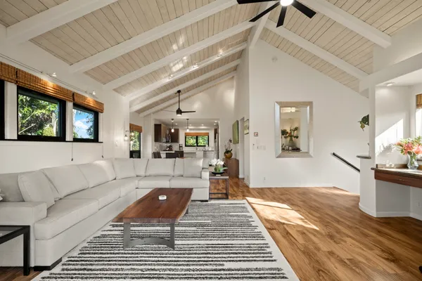 a living room with furniture and a rug