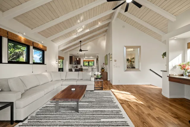 a living room with furniture and a rug