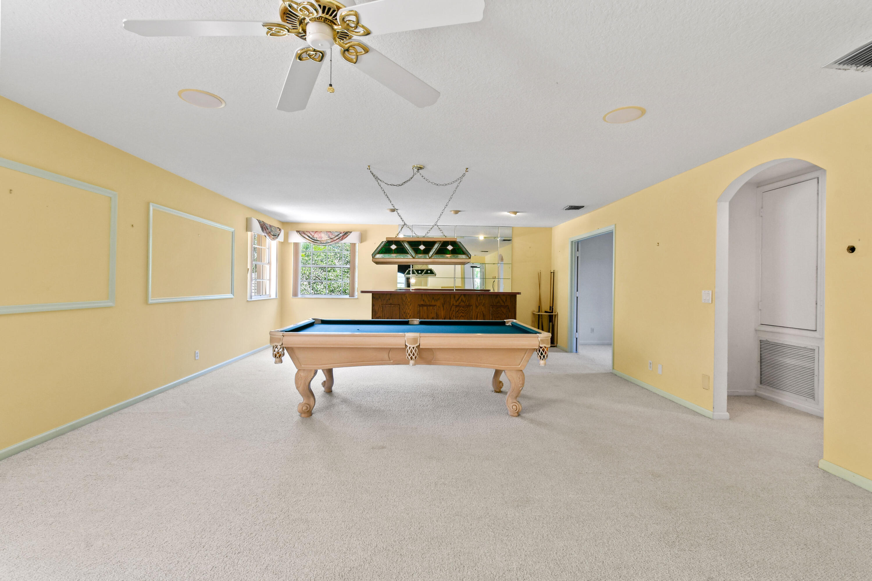 575 Scrubjay Lane Jupiter, FL 33458 - Photo 25 of 60 a living room with furniture and a chandelier