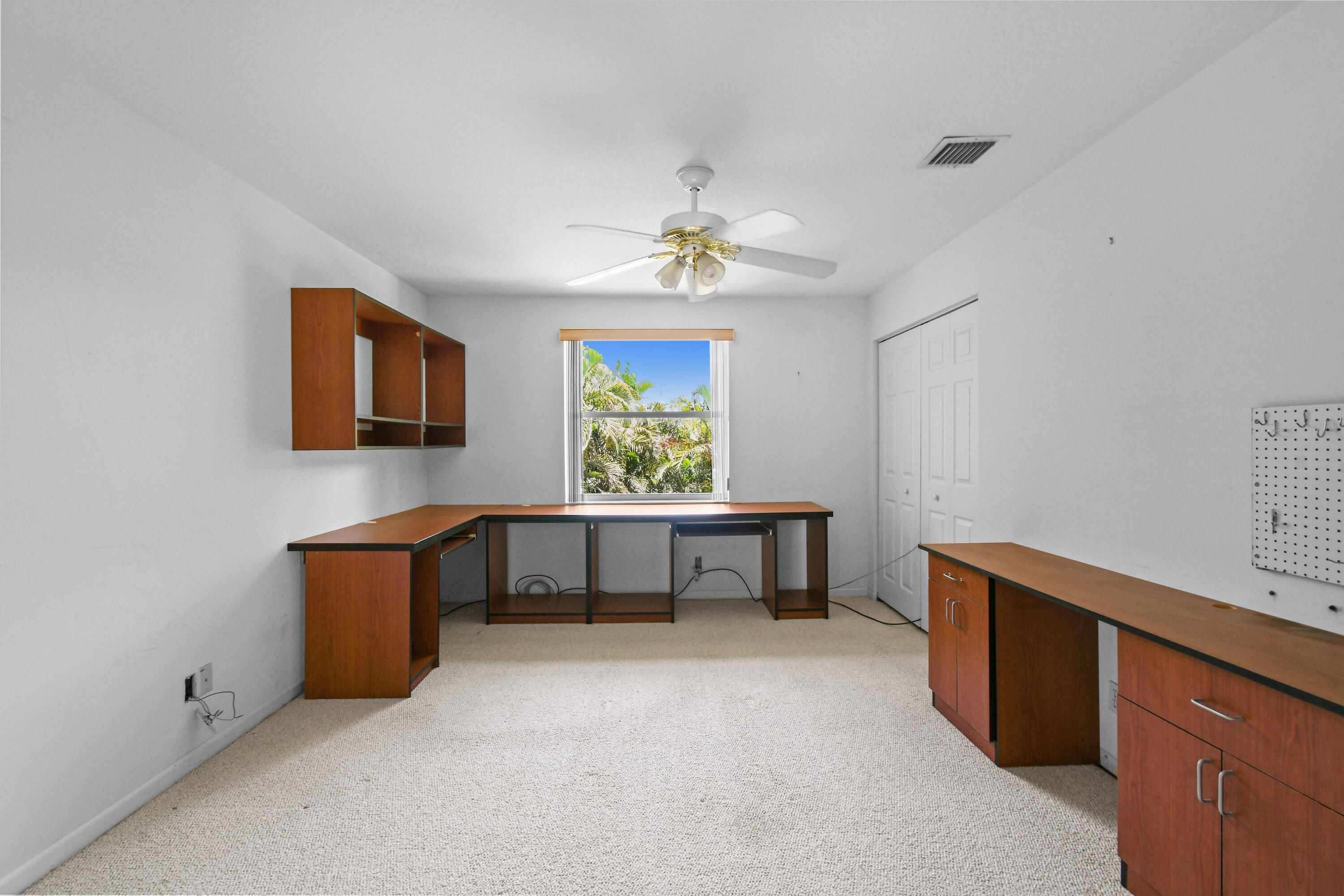 575 Scrubjay Lane Jupiter, FL 33458 - Photo 37 of 60 a workspace room with furniture and window