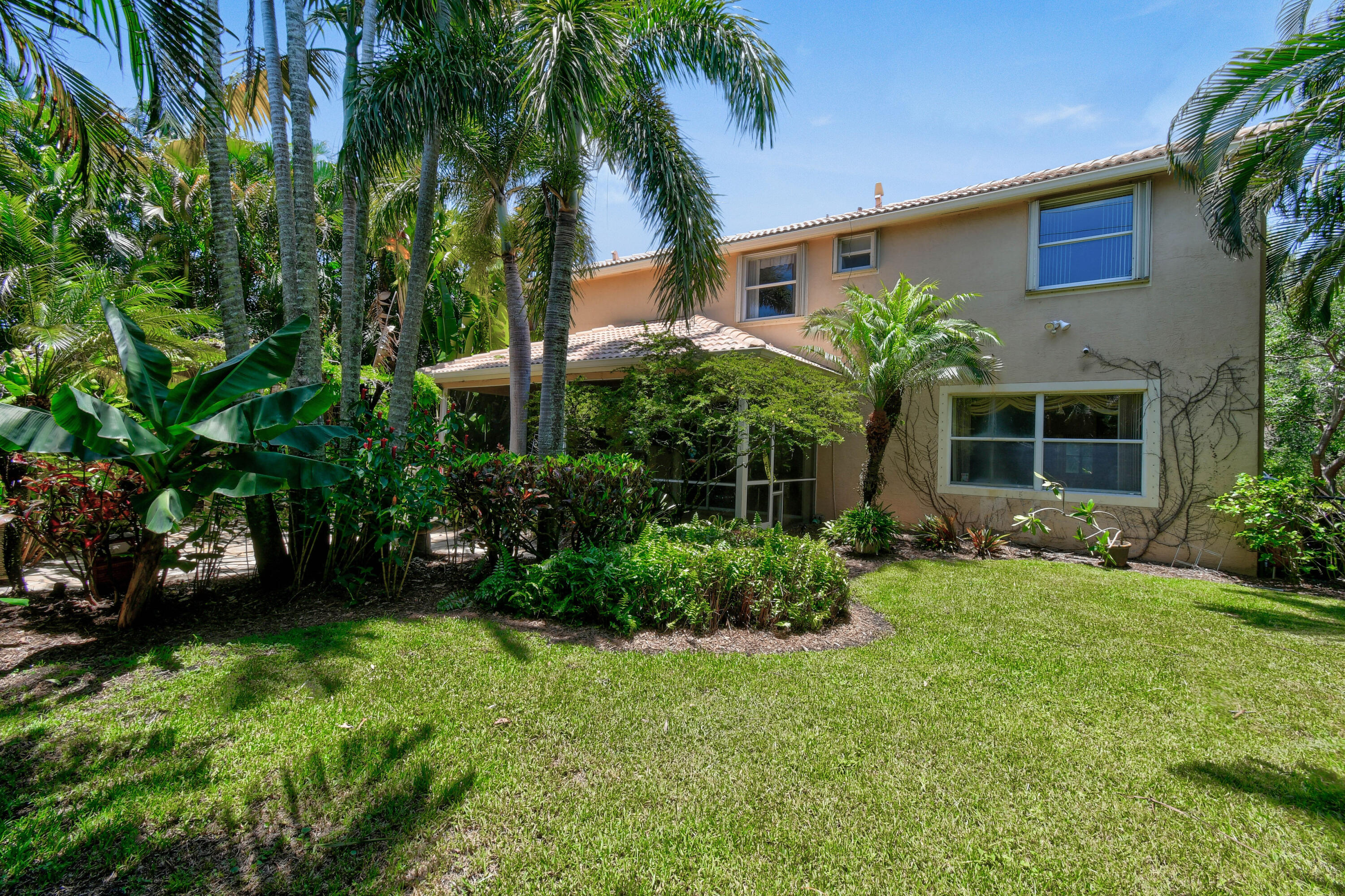 575 Scrubjay Lane Jupiter, FL 33458 - Photo 45 of 60 a view of a house with a yard and plants