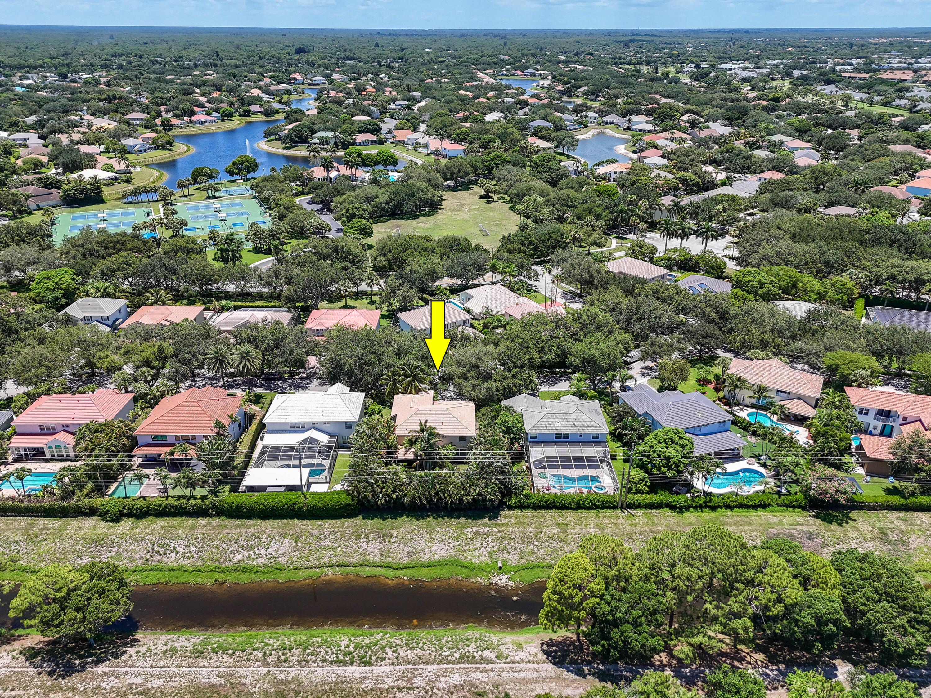 575 Scrubjay Lane Jupiter, FL 33458 - Photo 52 of 60 an aerial view of residential houses with outdoor space and trees