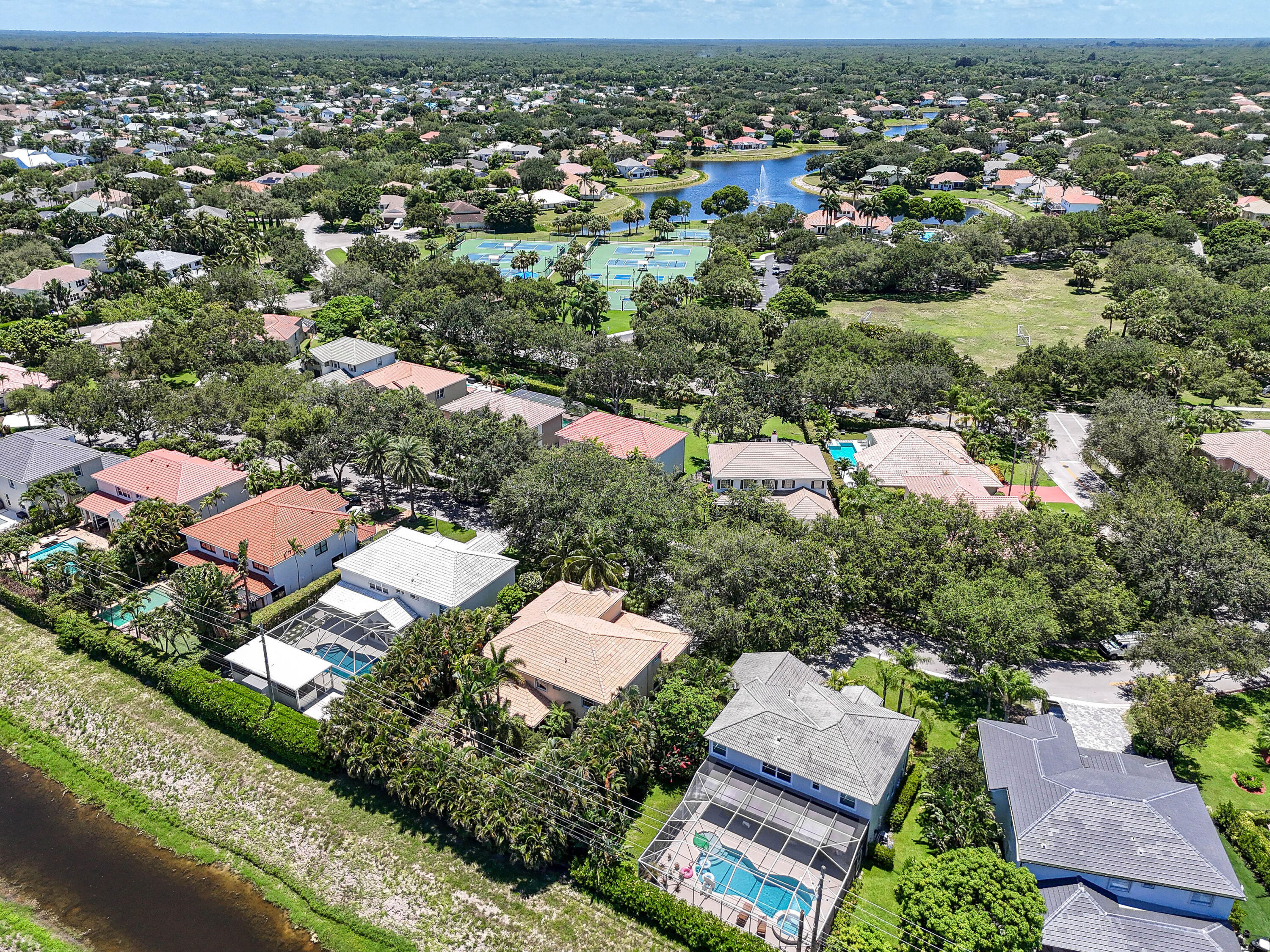 575 Scrubjay Lane Jupiter, FL 33458 - Photo 53 of 60 an aerial view of residential houses with outdoor space and trees