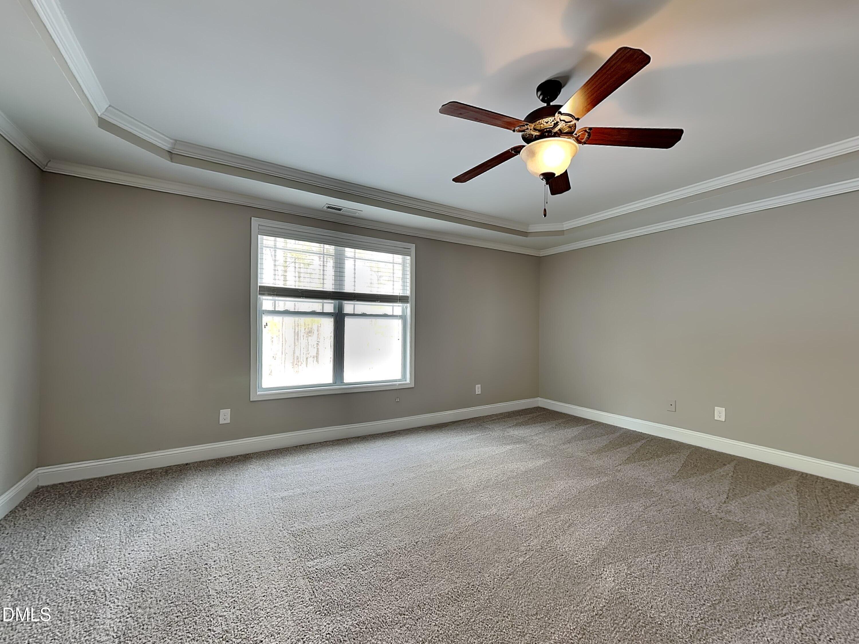 161 Summit Overlook Drive Clayton, NC 27527 - Photo 9 of 25 a view of a livingroom with a ceiling fan and window