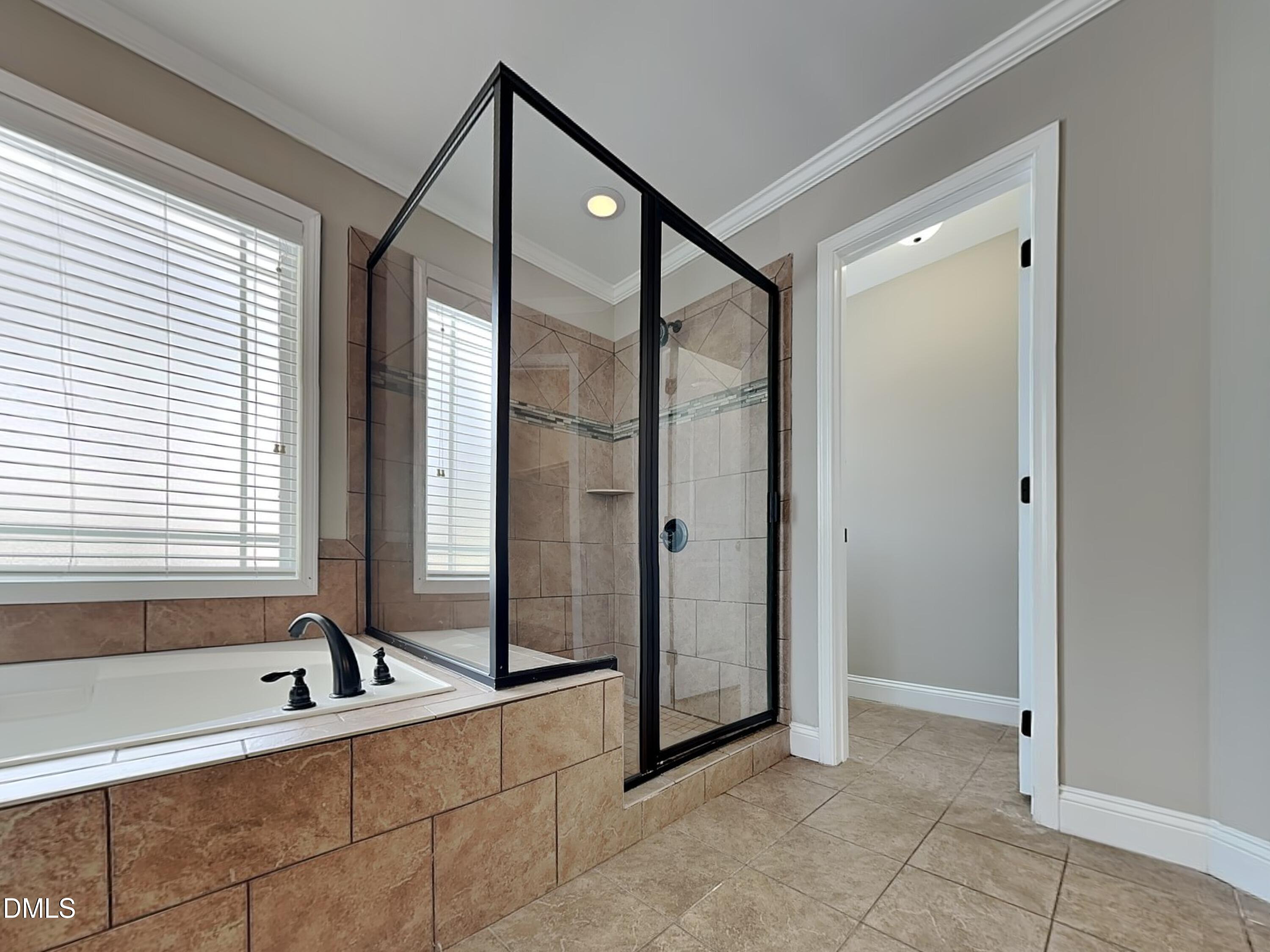 161 Summit Overlook Drive Clayton, NC 27527 - Photo 10 of 25 a bathroom with a tub and a shower