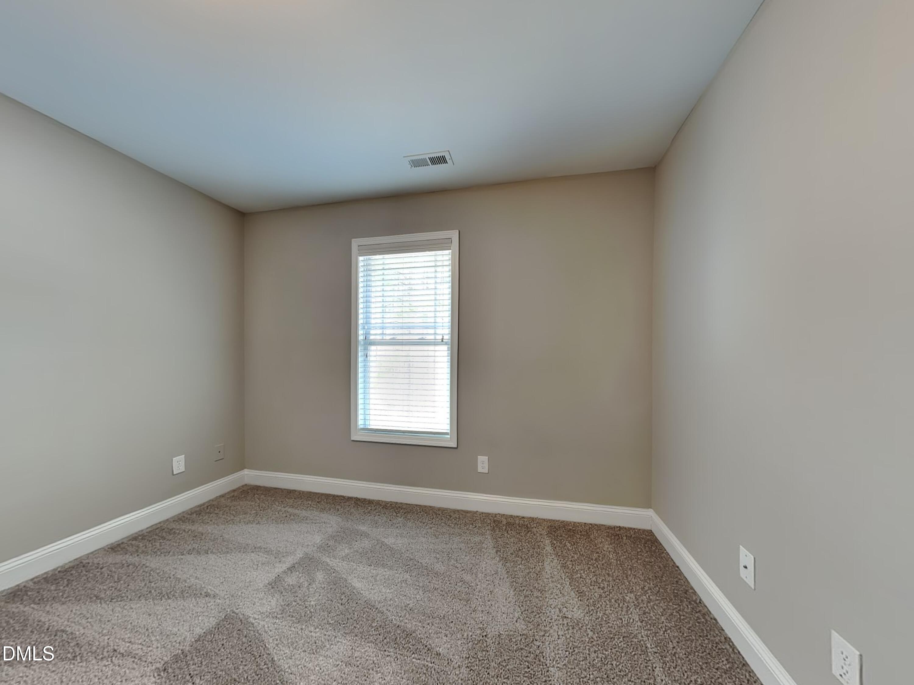 161 Summit Overlook Drive Clayton, NC 27527 - Photo 12 of 25 an empty room with a window