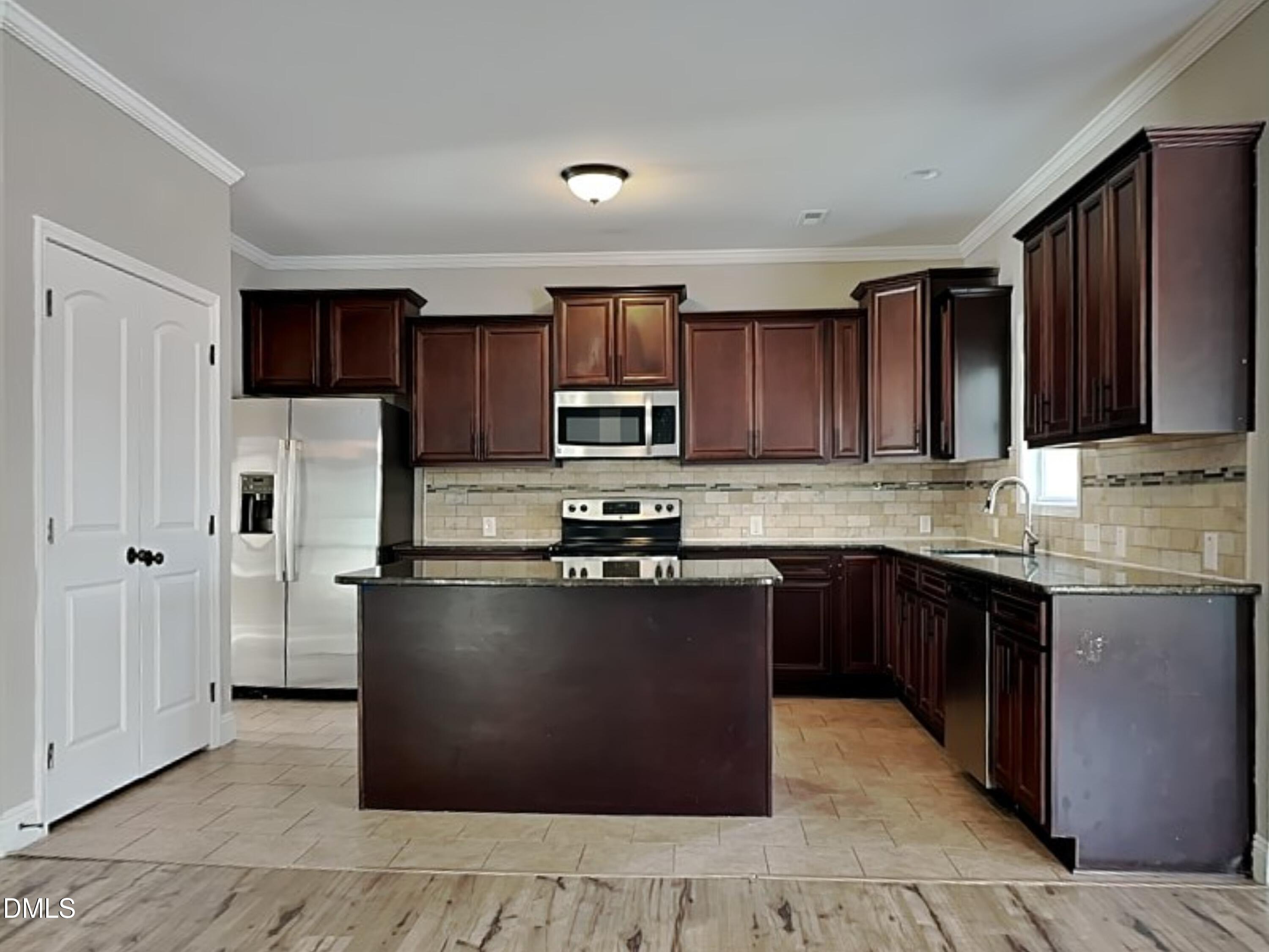 161 Summit Overlook Drive Clayton, NC 27527 - Photo 3 of 25 a kitchen with stainless steel appliances granite countertop a stove a sink dishwasher a refrigerator and a microwave oven