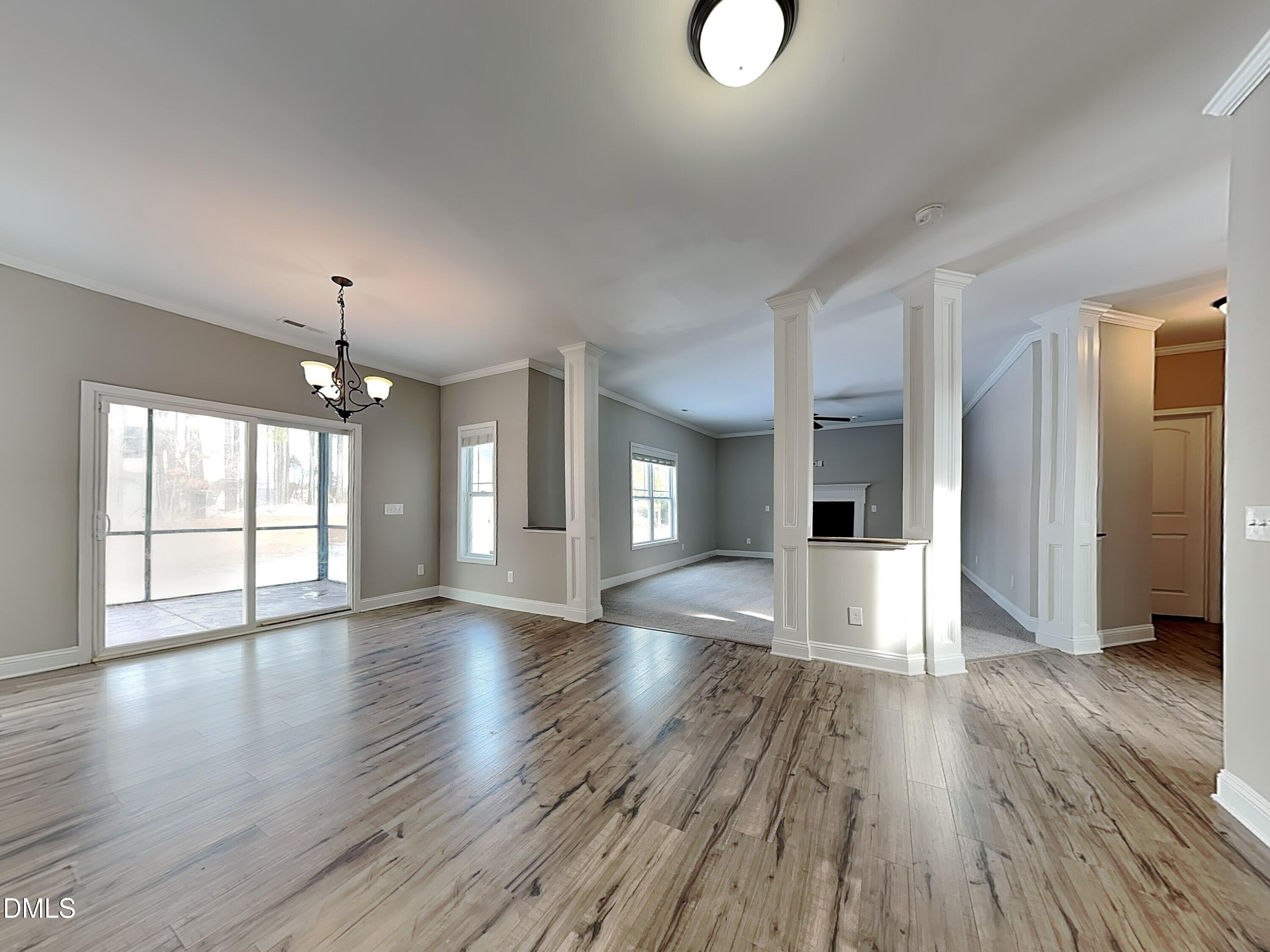 161 Summit Overlook Drive Clayton, NC 27527 - Photo 5 of 25 a view of an empty room with window and wooden floor
