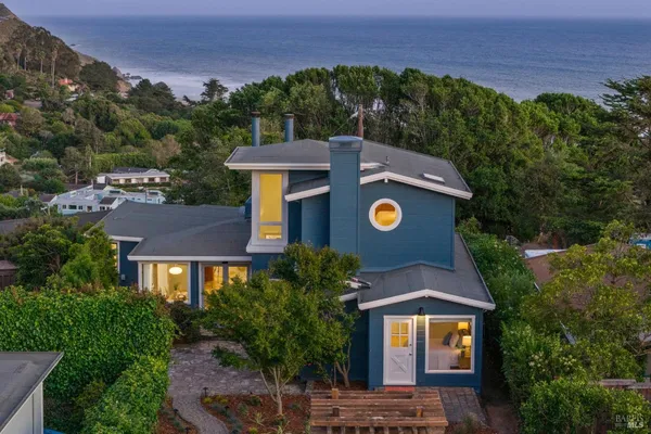 an aerial view of a house with a garden