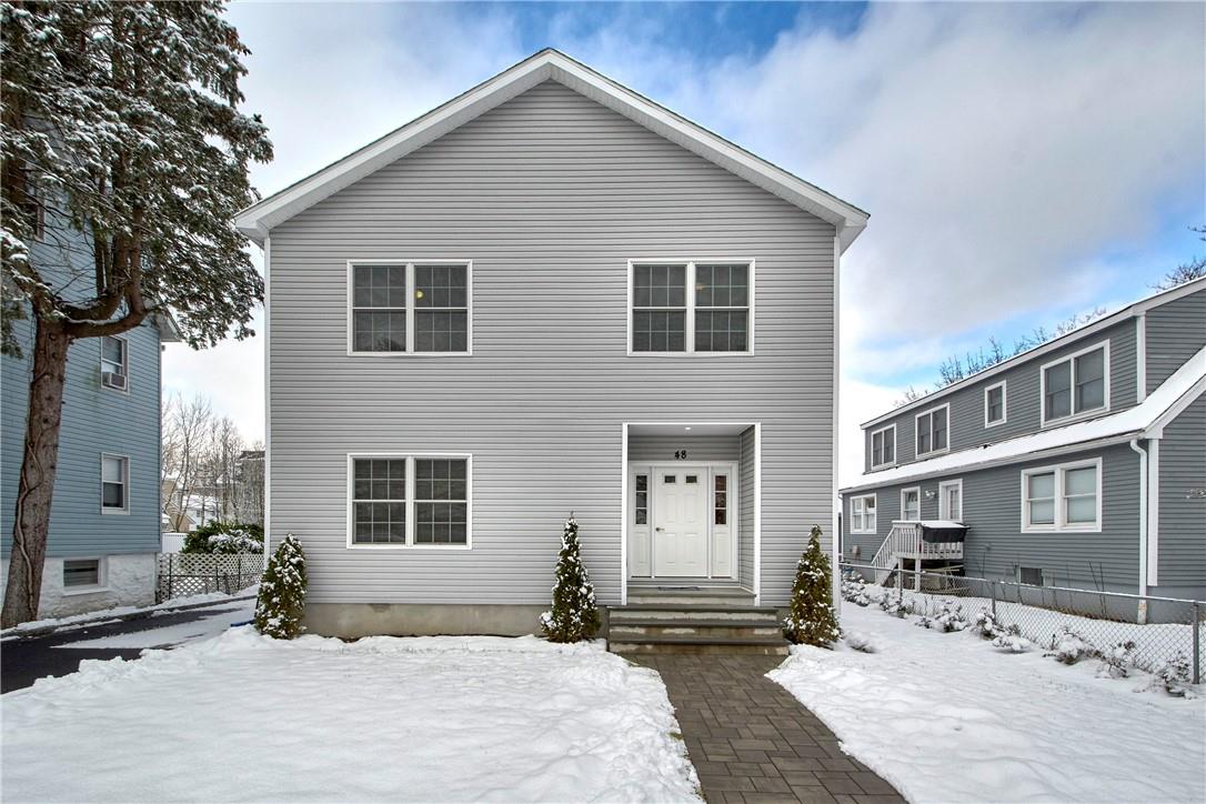 48 Cedar Place, Unit 2 Rye, NY 10580 - Photo 1 of 1 a front view of a house with yard