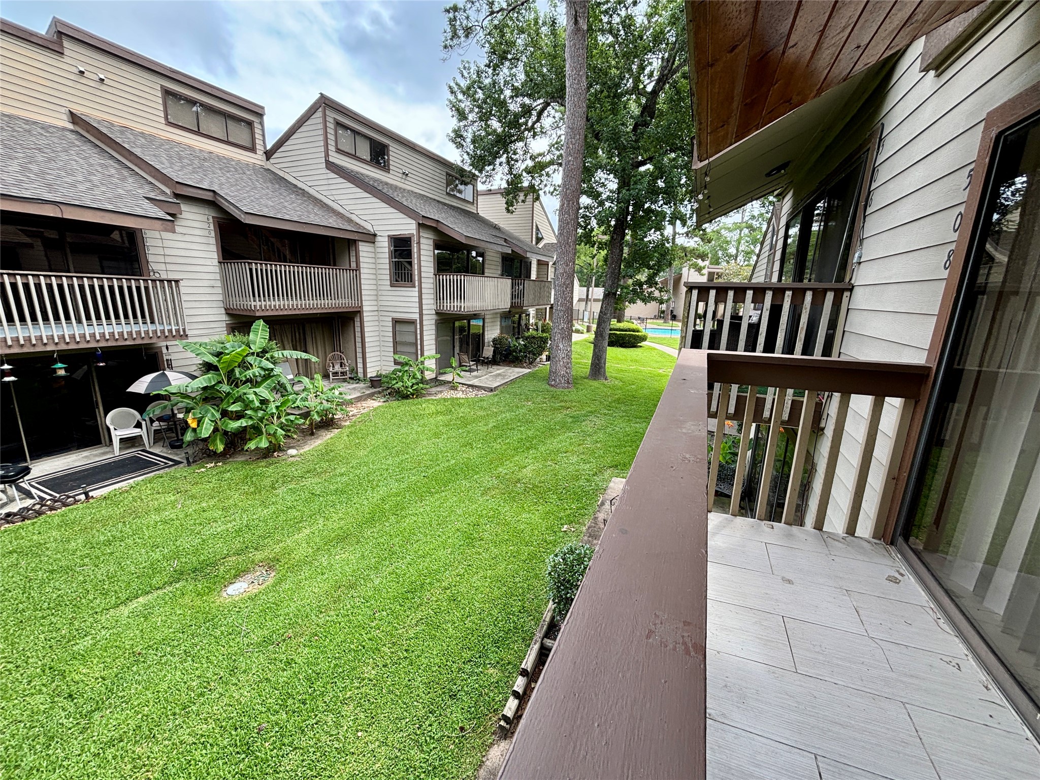 12900 Walden Road, Unit 508E Montgomery, TX 77356 - Photo 19 of 25 a view of a house with a yard