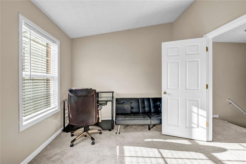 1246 Adcox Square Stone Mountain, GA 30088 - Photo 15 of 22 a view of a workspace with furniture and a window