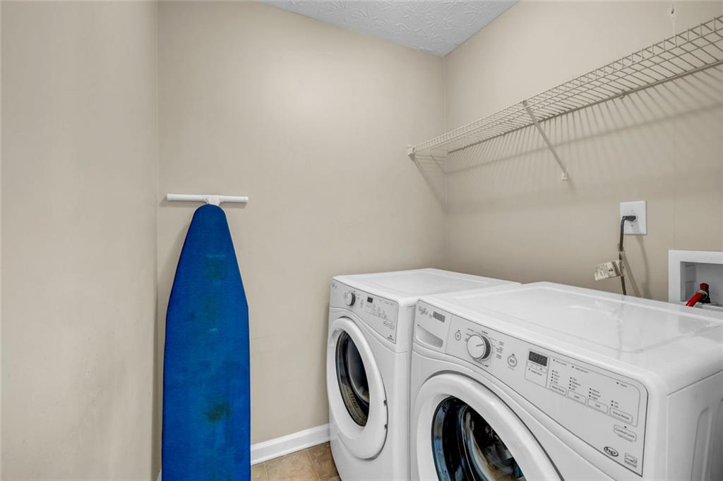 1246 Adcox Square Stone Mountain, GA 30088 - Photo 19 of 22 a utility room with dryer and washer
