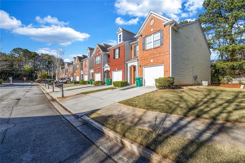 1246 Adcox Square Stone Mountain, GA 30088 - Photo 2 of 22 a view of a building with a street