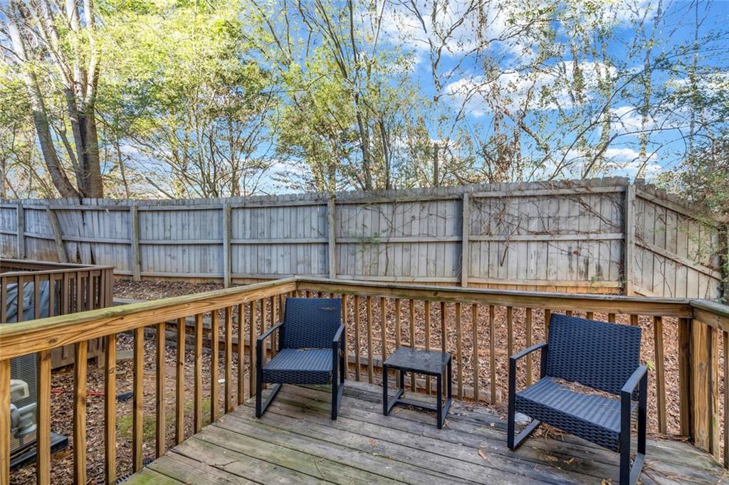 1246 Adcox Square Stone Mountain, GA 30088 - Photo 4 of 22 a view of a chair and table on the wooden floor