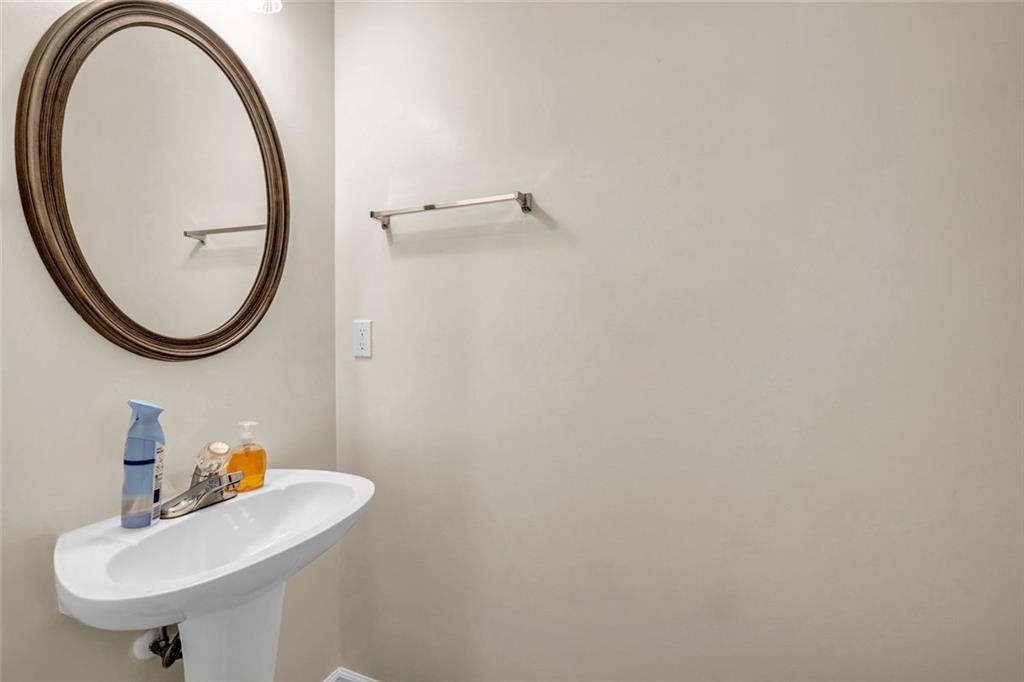 1246 Adcox Square Stone Mountain, GA 30088 - Photo 5 of 22 a bathroom with a sink and a mirror