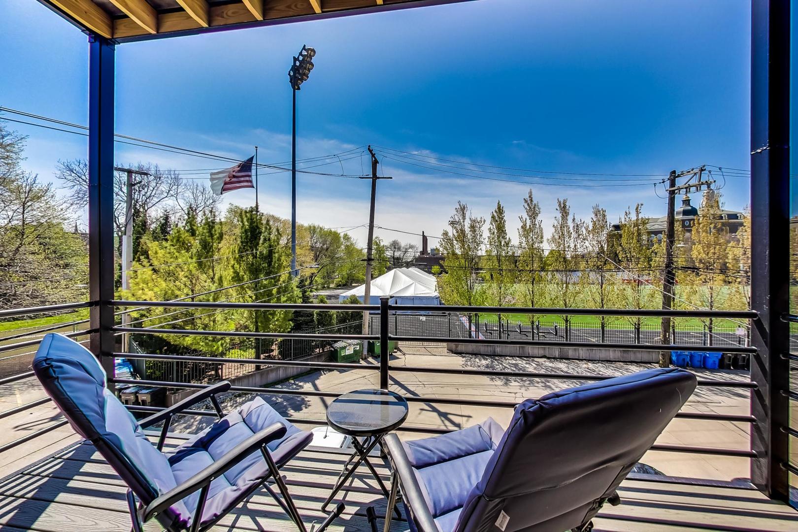 1033 West Taylor Street, Unit 2E Chicago, IL 60607 - Photo 15 of 20 a view of a chairs and tables in the balcony