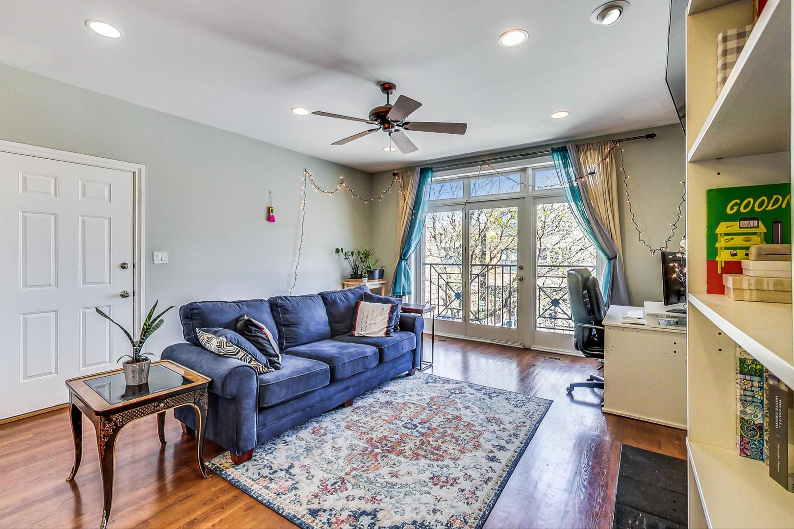 1033 West Taylor Street, Unit 2E Chicago, IL 60607 - Photo 4 of 20 a living room with furniture and a large window