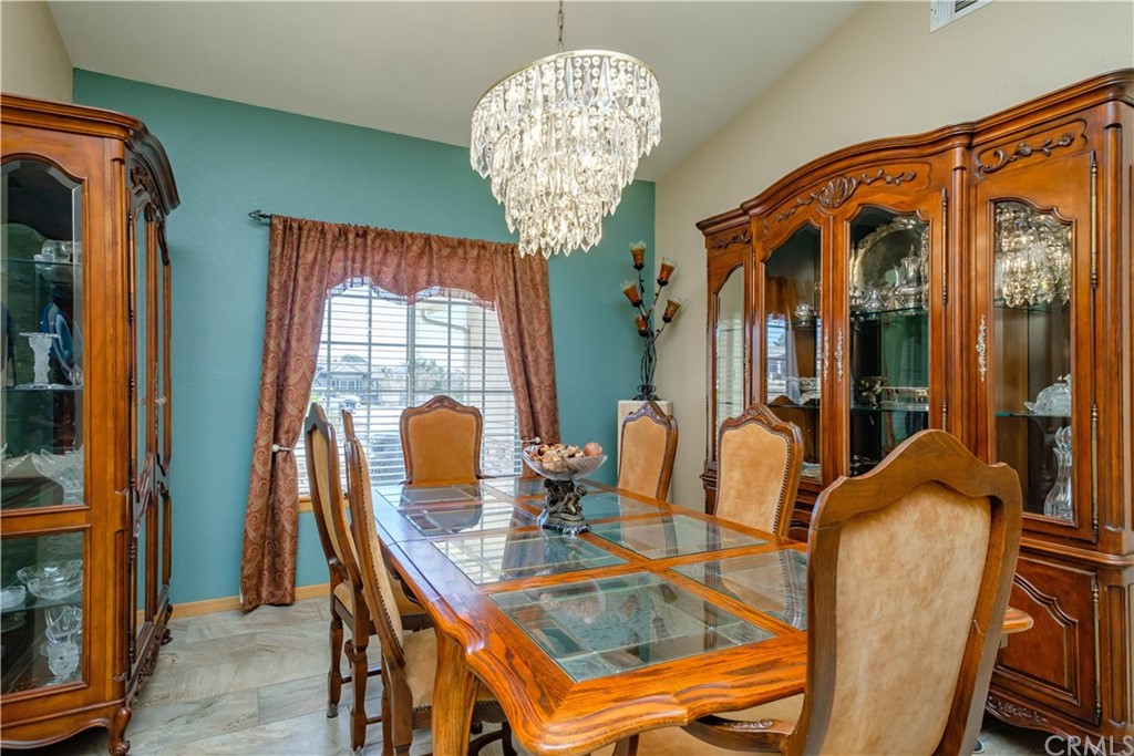 16196 Ridge View Drive Apple Valley, CA 92307 - Photo 12 of 68 a view of a dining room with furniture and chandelier