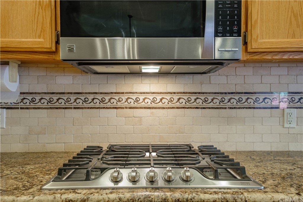 16196 Ridge View Drive Apple Valley, CA 92307 - Photo 20 of 68 a kitchen with a stove and cabinets