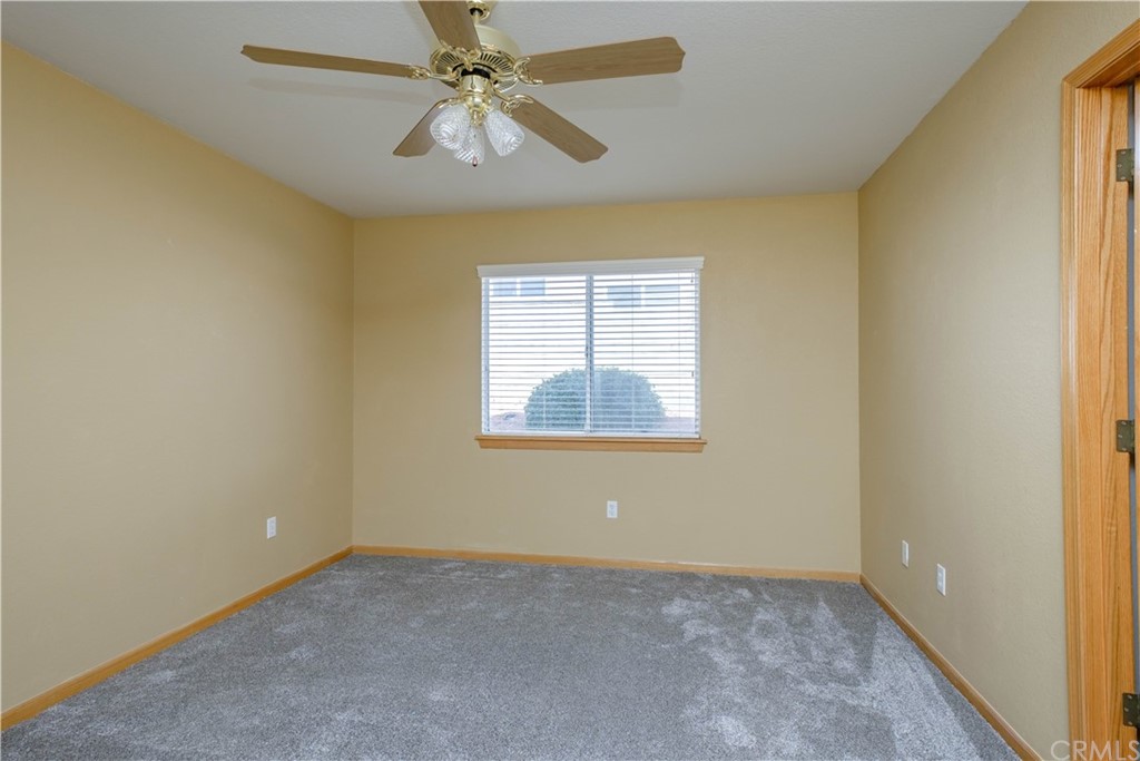 16196 Ridge View Drive Apple Valley, CA 92307 - Photo 31 of 68 an empty room with windows and fan