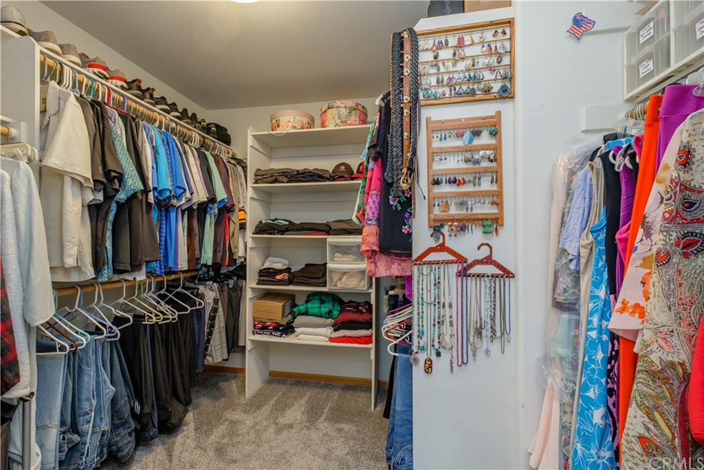 16196 Ridge View Drive Apple Valley, CA 92307 - Photo 38 of 68 a view of walk in closet with clothes and shoes