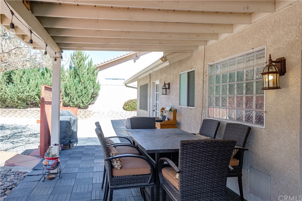 16196 Ridge View Drive Apple Valley, CA 92307 - Photo 46 of 68 a view of a dining room with furniture window and wooden floor